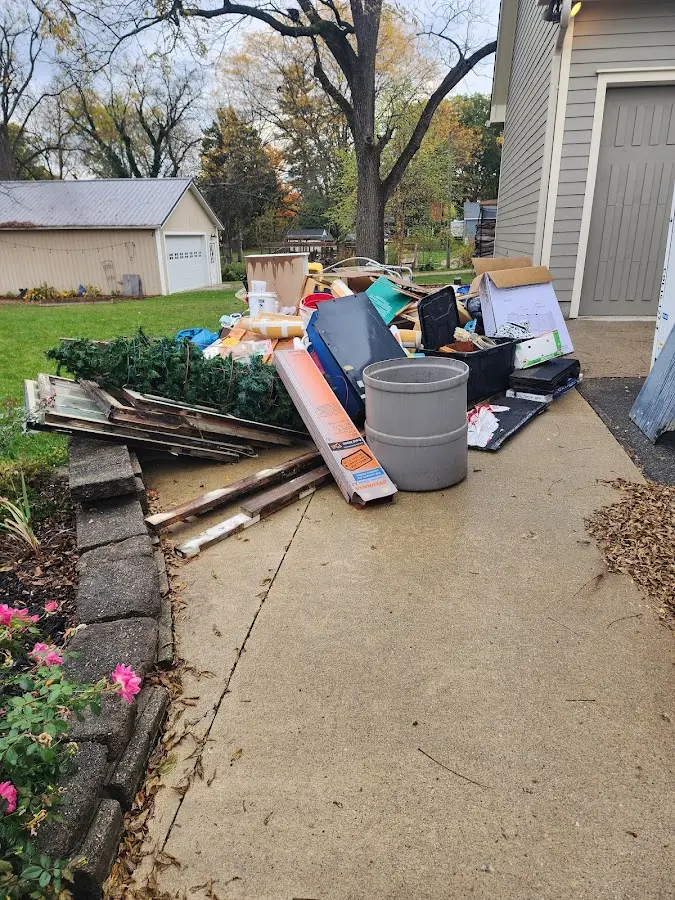 Dumpster being loaded with debris for 3 Yard Dumpster Rental in Huntingtown